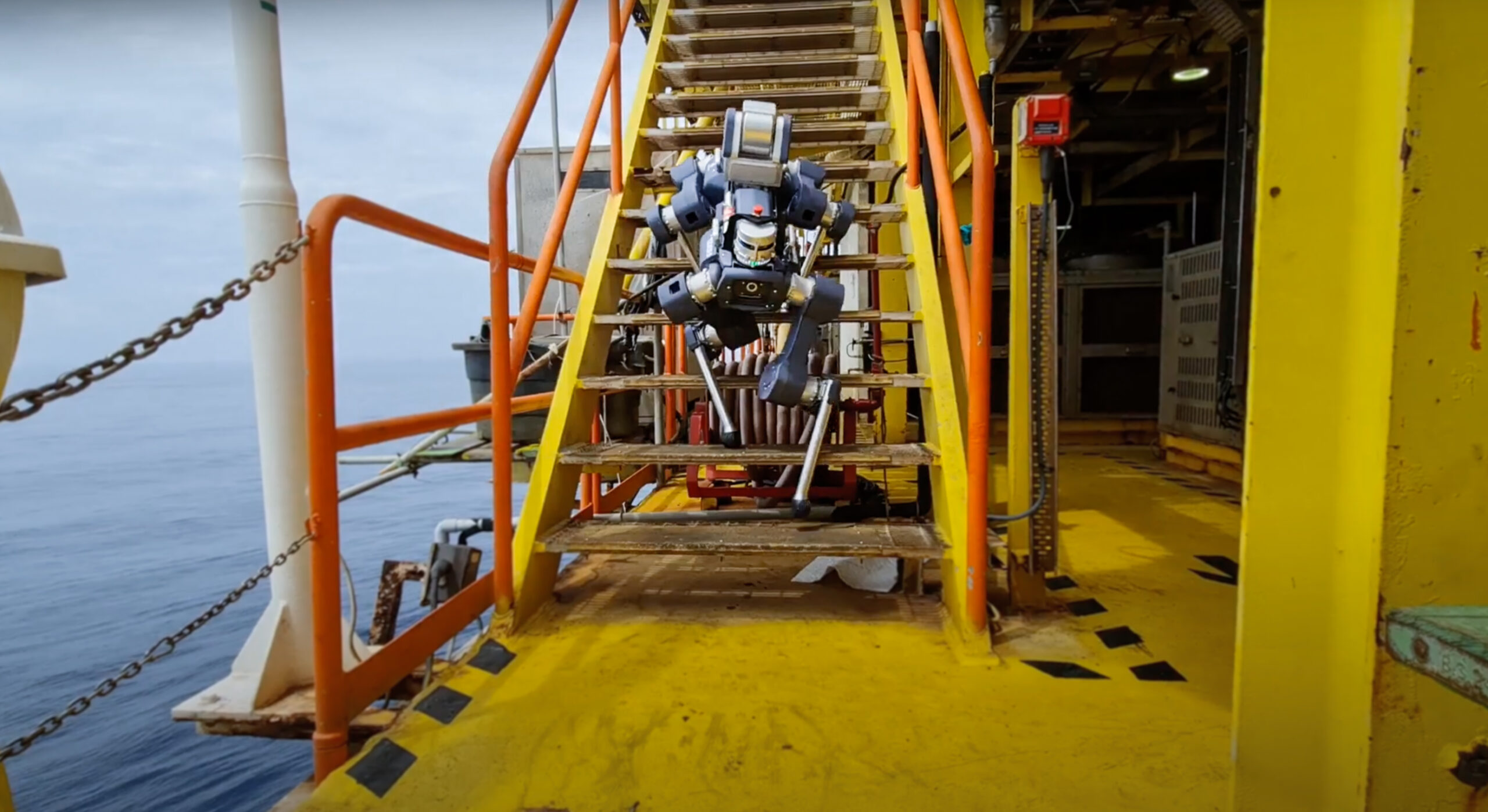 anymal x climbing down a stair on an offshore platform