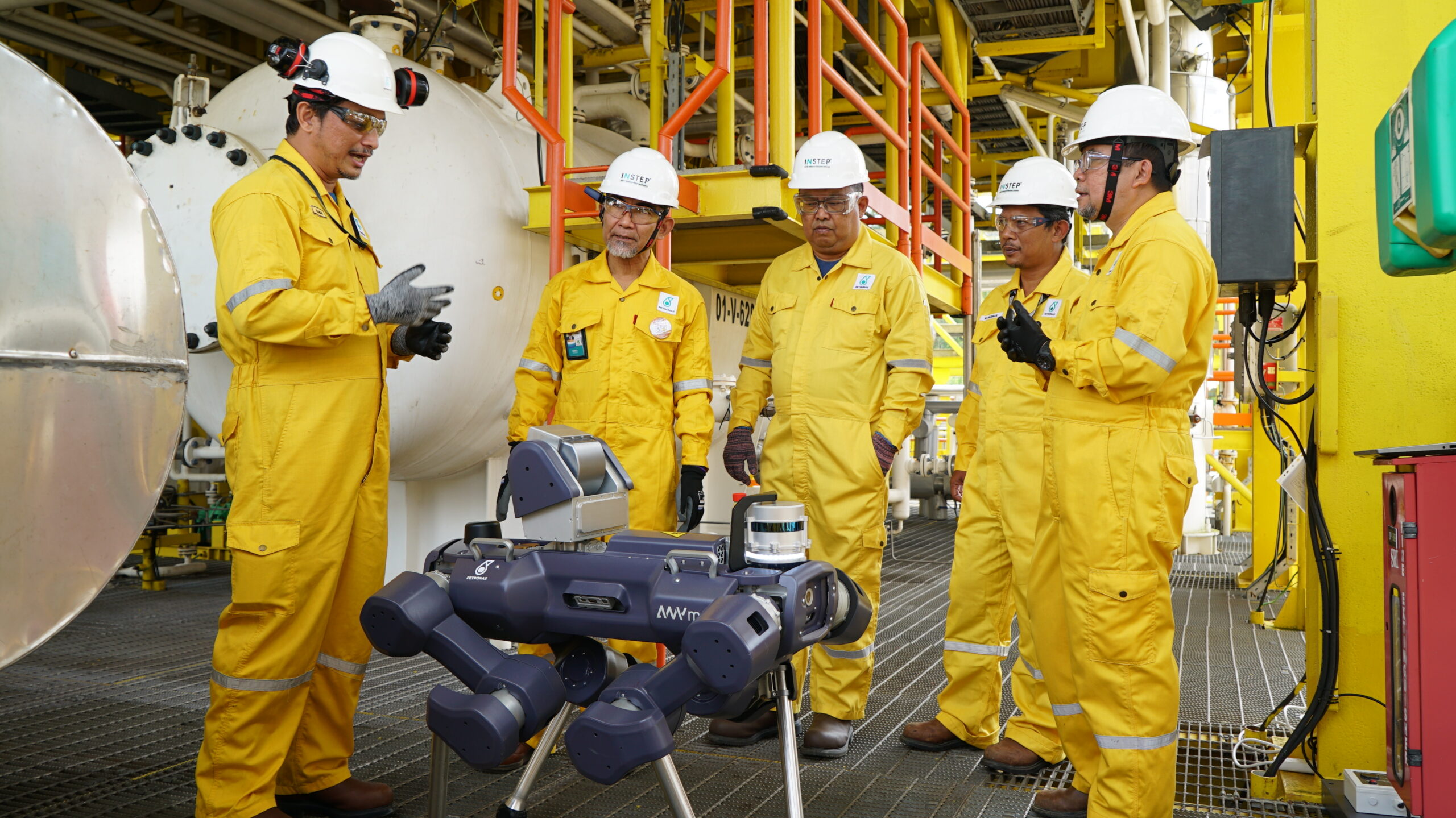 Workers from Petronas standing around ANYmal X