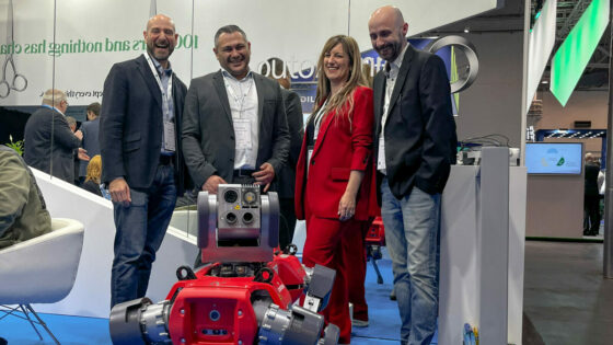 Staff from ANYbotics and Outokumpu stand around ANYmal to celebrate their newly announced partnership